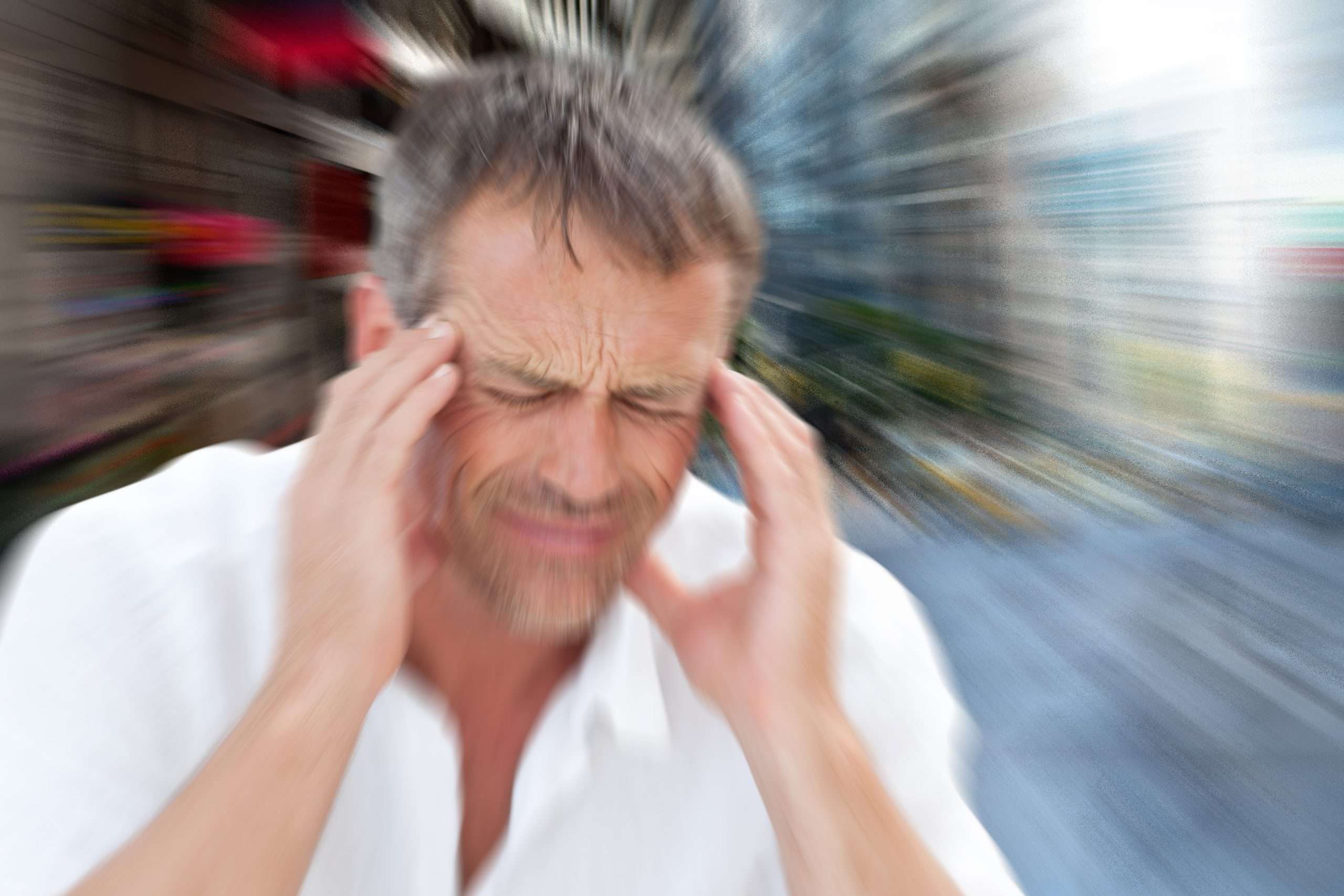 Man with headache against new york street