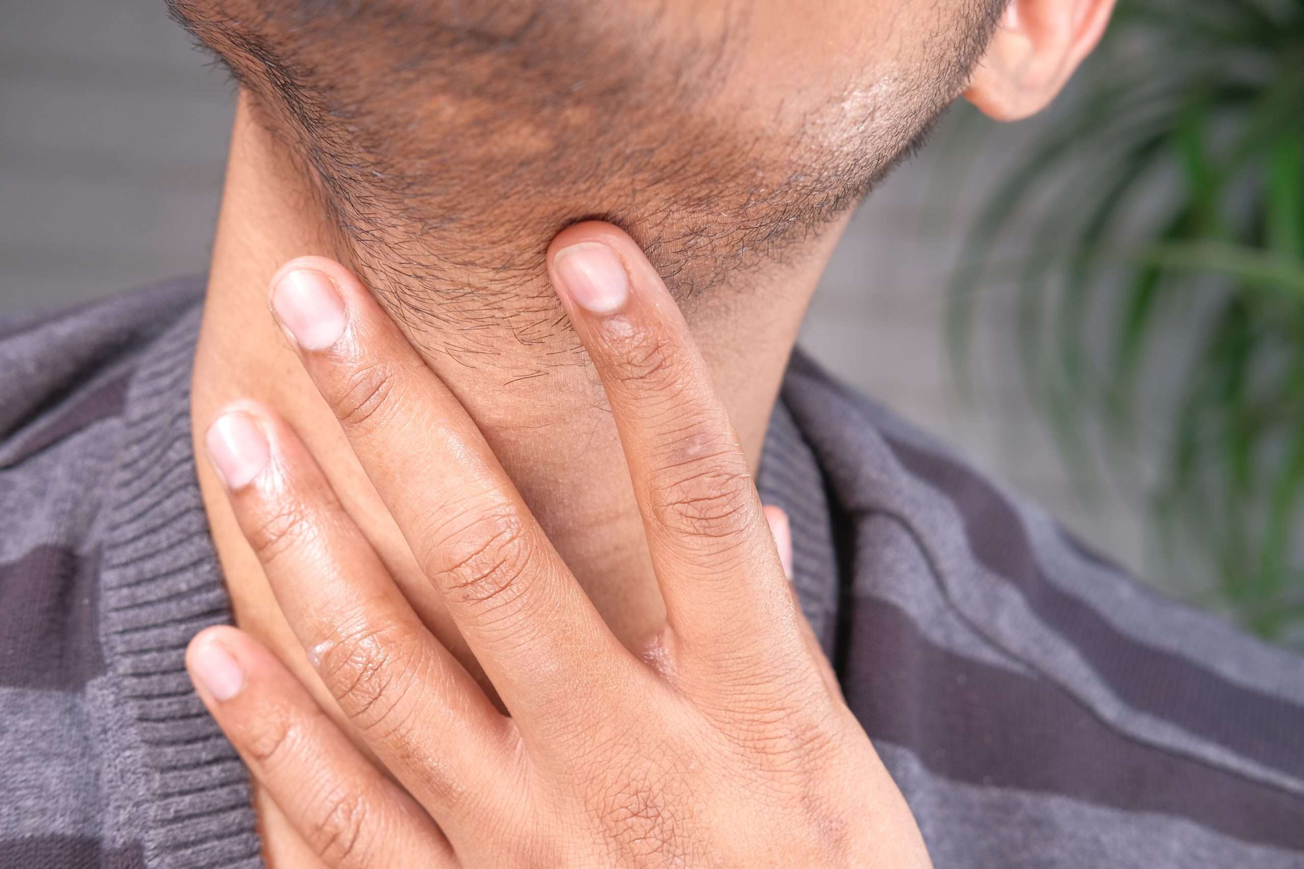 unrecognized man suffering throat pain close up
